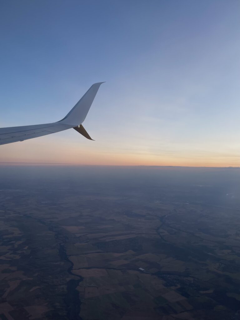 Plane wing at sunset.